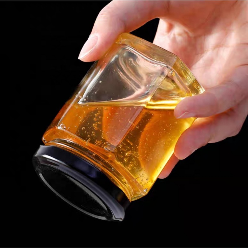 China Manufacturer Cheap 40ml 85ml 100ml 180ml 280ml 380ml 500ml Glass Honey Jar Transparent Hexagon Glass Jars
